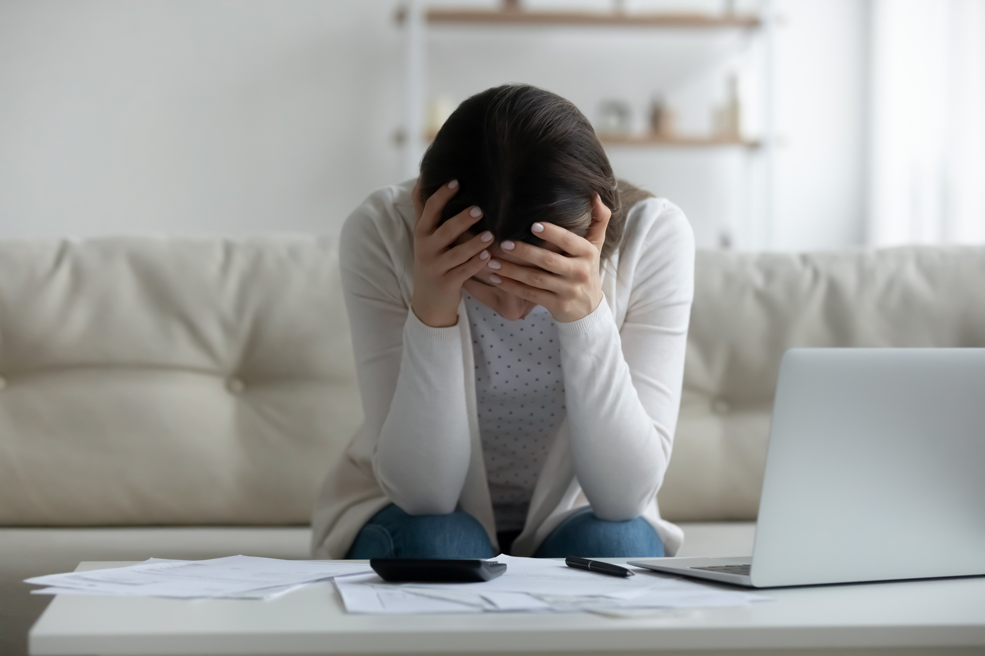 Frustrated young woman feeling stressed about financial problems.