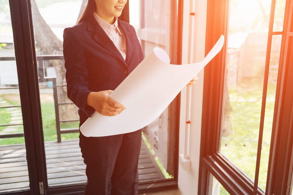 Close Up of Architect Looking at the Blueprint